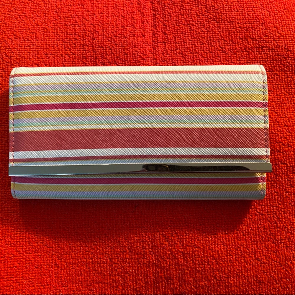 Colorful striped wallet with snap closure and 2 zip compartments.